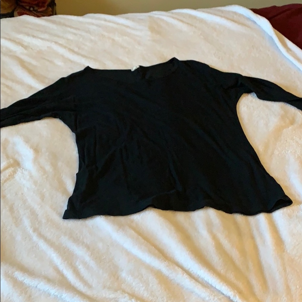 Back, 3/4 sleeve, light shirt.